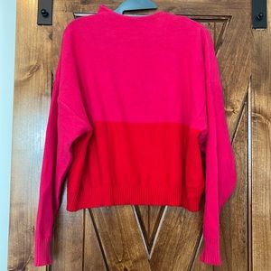 Bright pink and red color block sweater